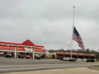 Roadside Cajun restaurant with clean dining area where travelers enjoy hearty Southern dishes, featuring both restaurant...