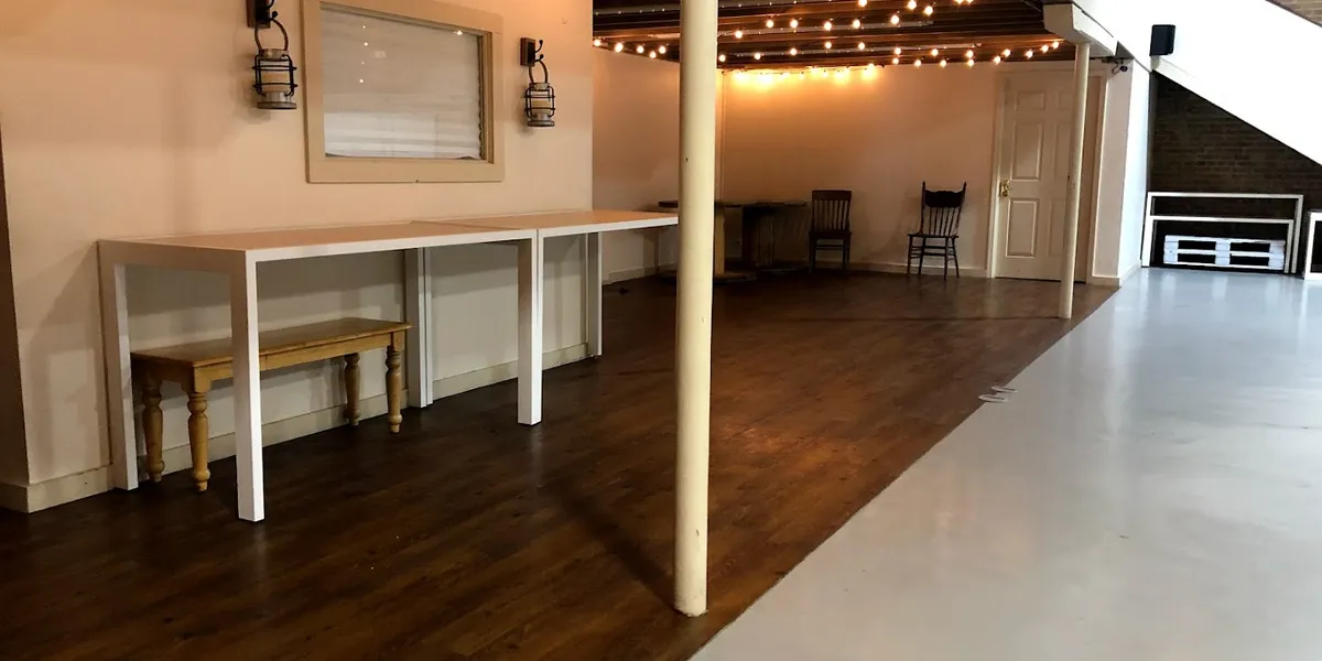 Historic brick venue with atmospheric candlelit interior, featuring performance space with excellent acoustics for...