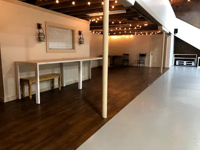 Historic brick venue with atmospheric candlelit interior, featuring performance space with excellent acoustics for...