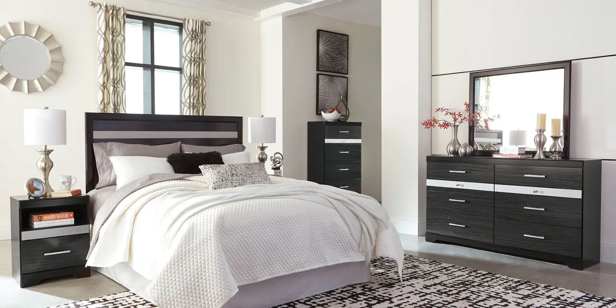 Showroom floor of Affordable Home Furnishings displaying arranged living room sets and appliances with payment plan...