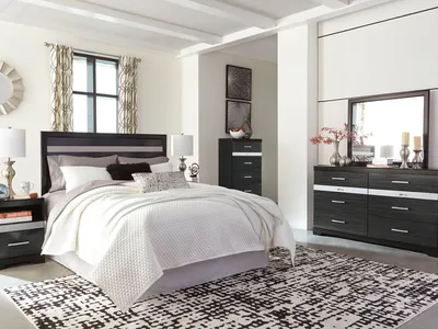 Showroom floor of Affordable Home Furnishings displaying arranged living room sets and appliances with payment plan...