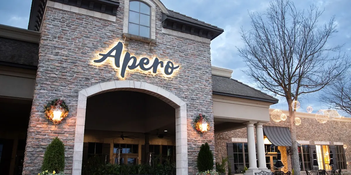 Elegantly appointed dining room with stylish decor, featuring both intimate indoor seating and a spacious outdoor patio...