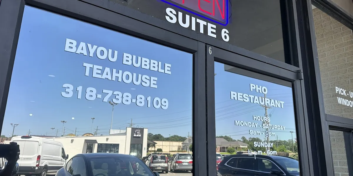 Cozy Vietnamese teahouse with traditional pho bowls and colorful bubble tea drinks served in a casual, family-friendly...