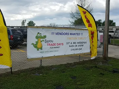 Open-air market with diverse vendor booths selling handcrafted goods and produce, families strolling between...