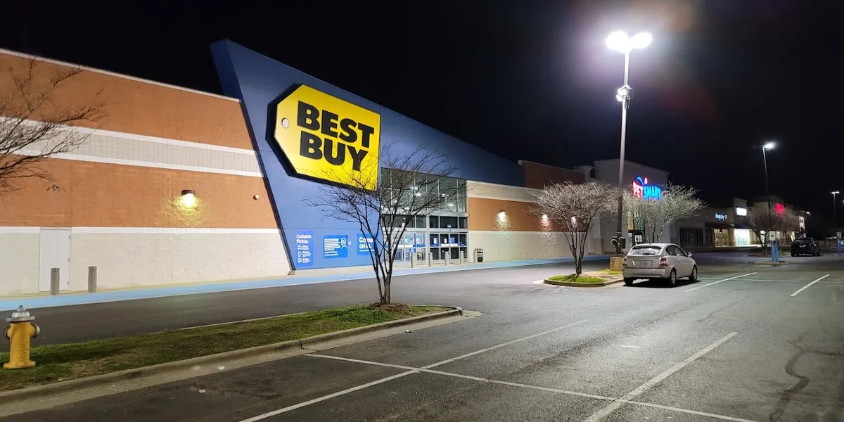 Spacious electronics retailer with product displays throughout the store floor, featuring TV wall mounts and a somewhat...
