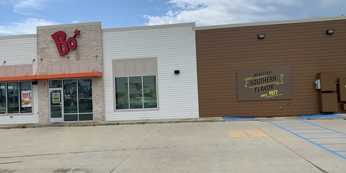 Newly redesigned Bojangles restaurant on Louisville Ave with outdoor seating area and drive-thru, showcasing...
