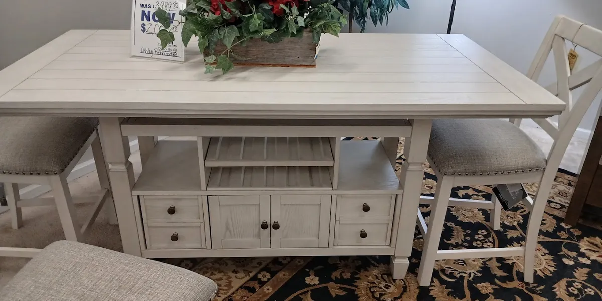 Spacious showroom of Burney's Furniture displaying arranged living room sets with diverse price-point options and leather...