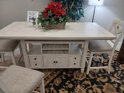 Spacious showroom of Burney's Furniture displaying arranged living room sets with diverse price-point options and leather...