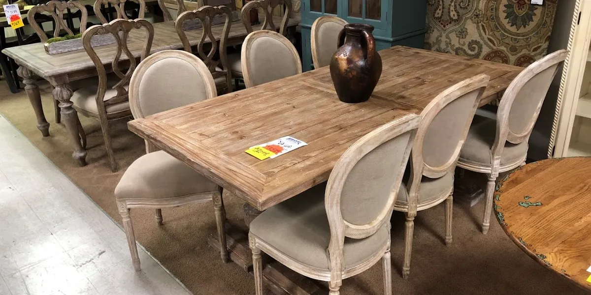 Spacious showroom displaying quality sectionals and recliners with warm lighting and traditional furniture arrangements...