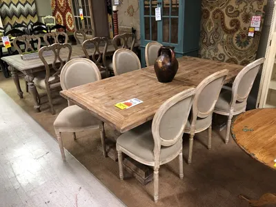 Spacious showroom displaying quality sectionals and recliners with warm lighting and traditional furniture arrangements...