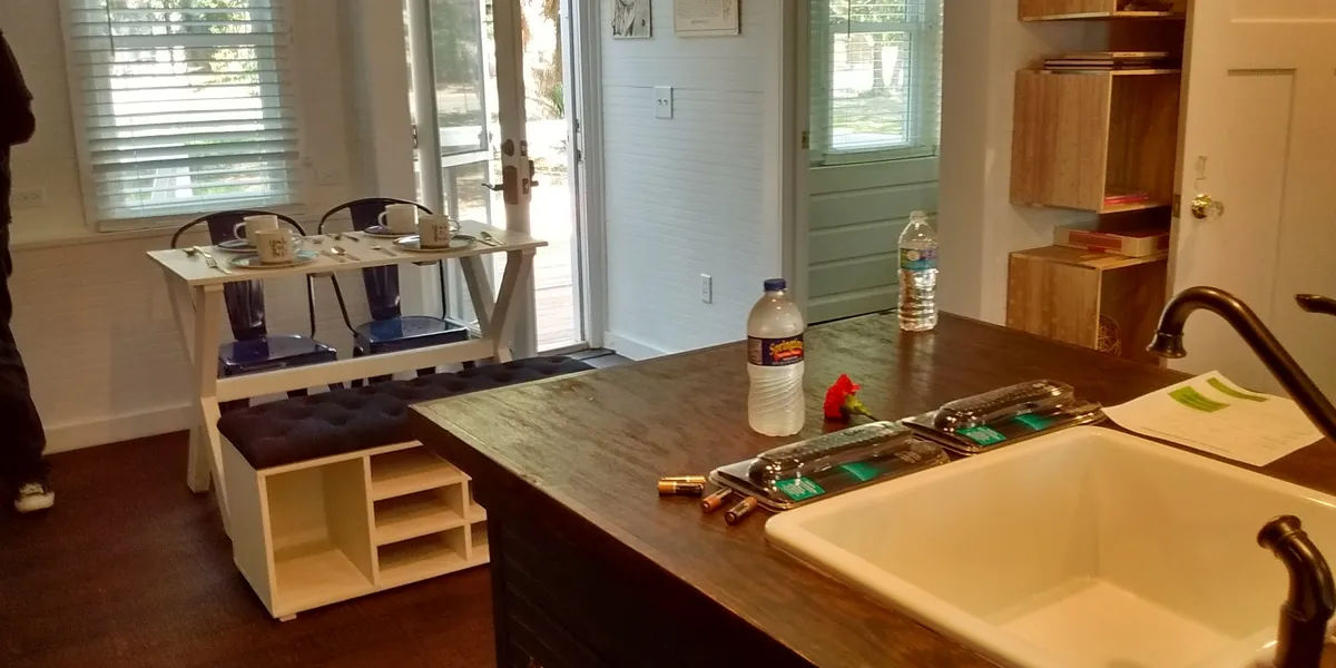 Neat rows of mobile homes with well-kept yards at Caldwell Estates, featuring playground equipment and picnic areas under...