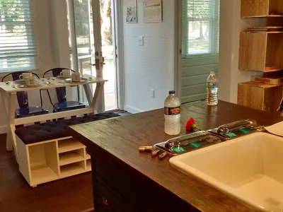 Neat rows of mobile homes with well-kept yards at Caldwell Estates, featuring playground equipment and picnic areas under...