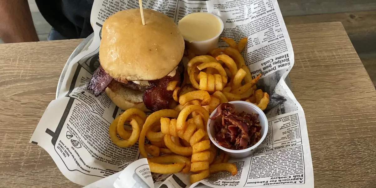 Waterfront restaurant with outdoor deck overlooking Ouachita Bayou, serving Southern comfort food in a casual riverside...