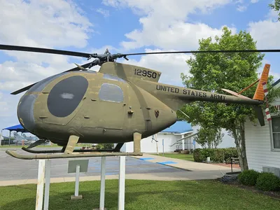 Chennault Aviation & Military Museum exterior with vintage aircraft displays on the grounds, showcasing historical planes...