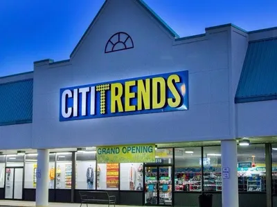 Spacious retail floor at Citi Trends with organized racks of affordable clothing, home goods, and accessories in a...