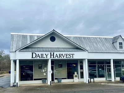 Cozy hole-in-the-wall eatery with counter service displaying freshly baked goods and a casual dining area for quick...