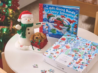 Meticulously organized Hallmark shop with abundant greeting cards, seasonal displays, and gift merchandise filling the...