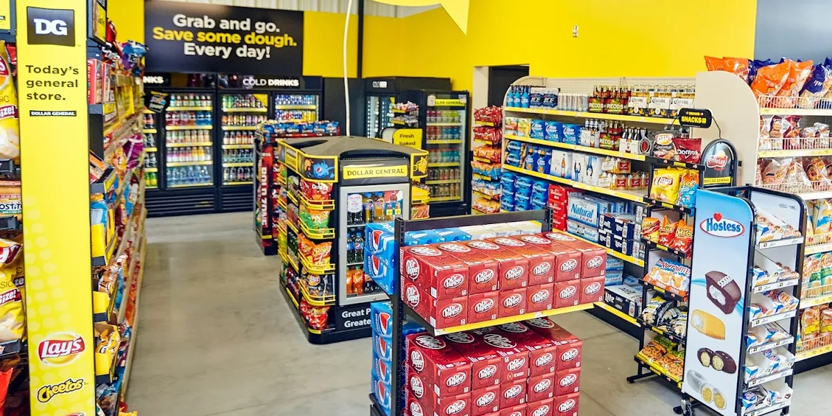 Compact neighborhood grocery store with basic amenities and checkout lanes, showing signs of wear but offering convenient...