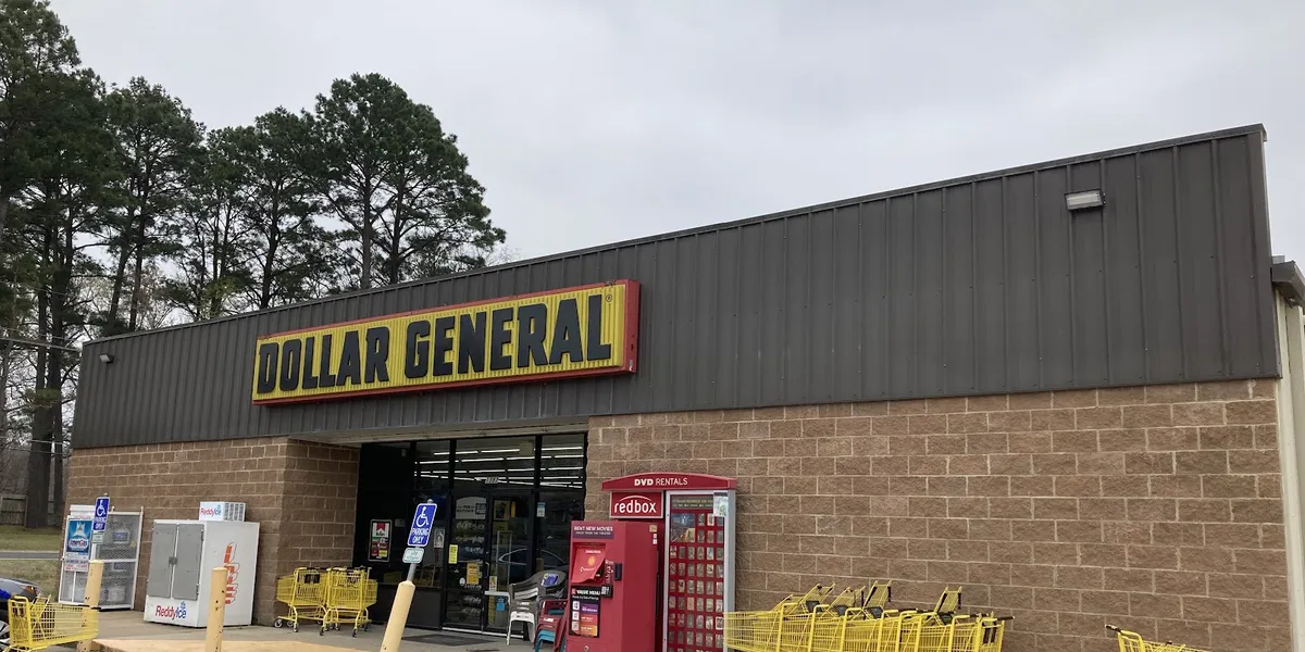 Newly built DG Market with spacious aisles, produce section, and expanded inventory in a bright, modern retail space with...