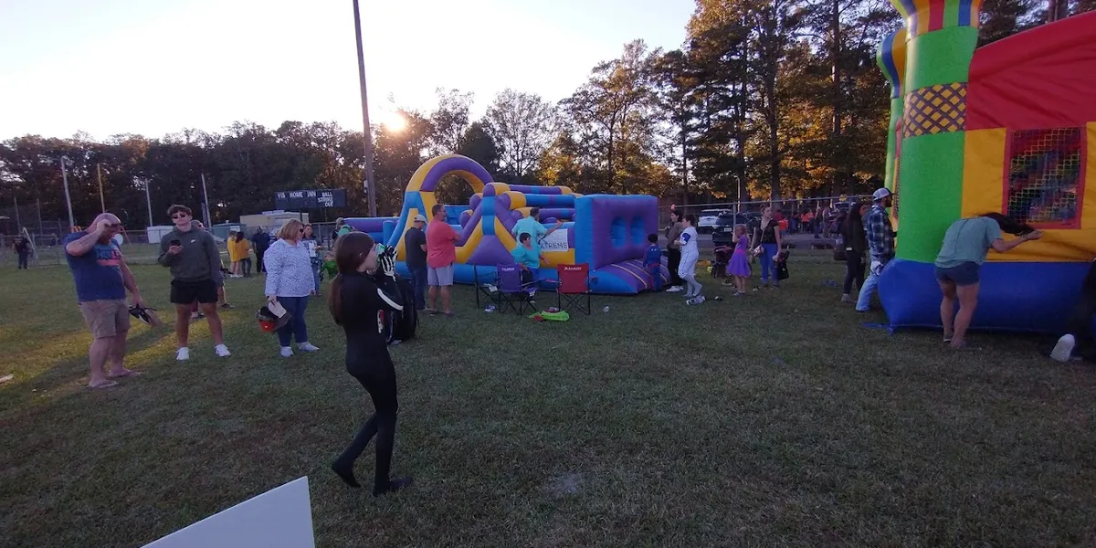 Brightly lit ballfields at East Ouachita Recreation Center with well-maintained grounds and community gathering spaces.