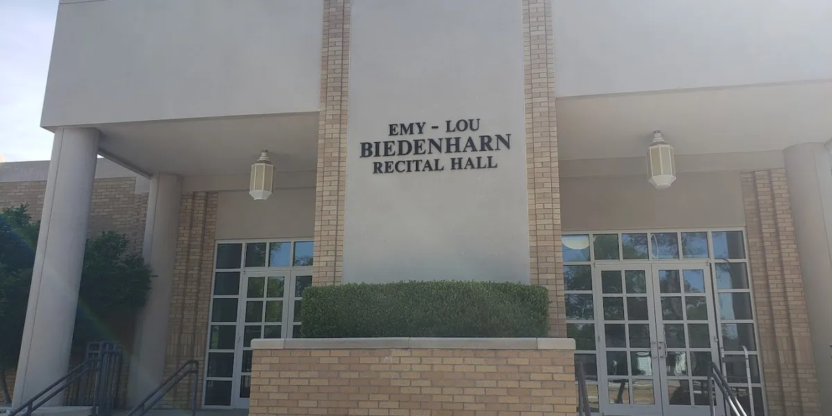 Interior of Emy-Lou Biedenharn Recital Hall showing tiered seating facing a well-lit stage with excellent acoustical...