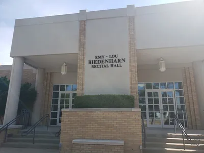 Interior of Emy-Lou Biedenharn Recital Hall showing tiered seating facing a well-lit stage with excellent acoustical...