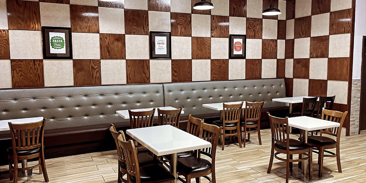 Bright, clean fast-casual Italian eatery with counter service, takeout containers, and simple dining area on Lamy Lane.