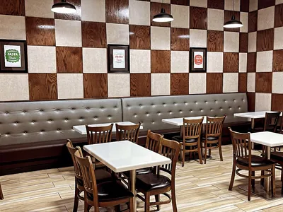 Bright, clean fast-casual Italian eatery with counter service, takeout containers, and simple dining area on Lamy Lane.