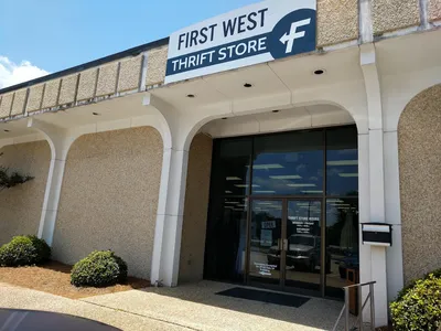 Neatly organized thrift store with diverse merchandise sections, well-displayed items, and clear signage for weekly...