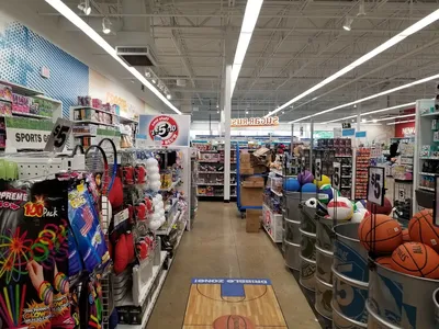 Bright, organized aisles at Five Below Monroe displaying colorful budget merchandise from toys and candy to fitness gear...