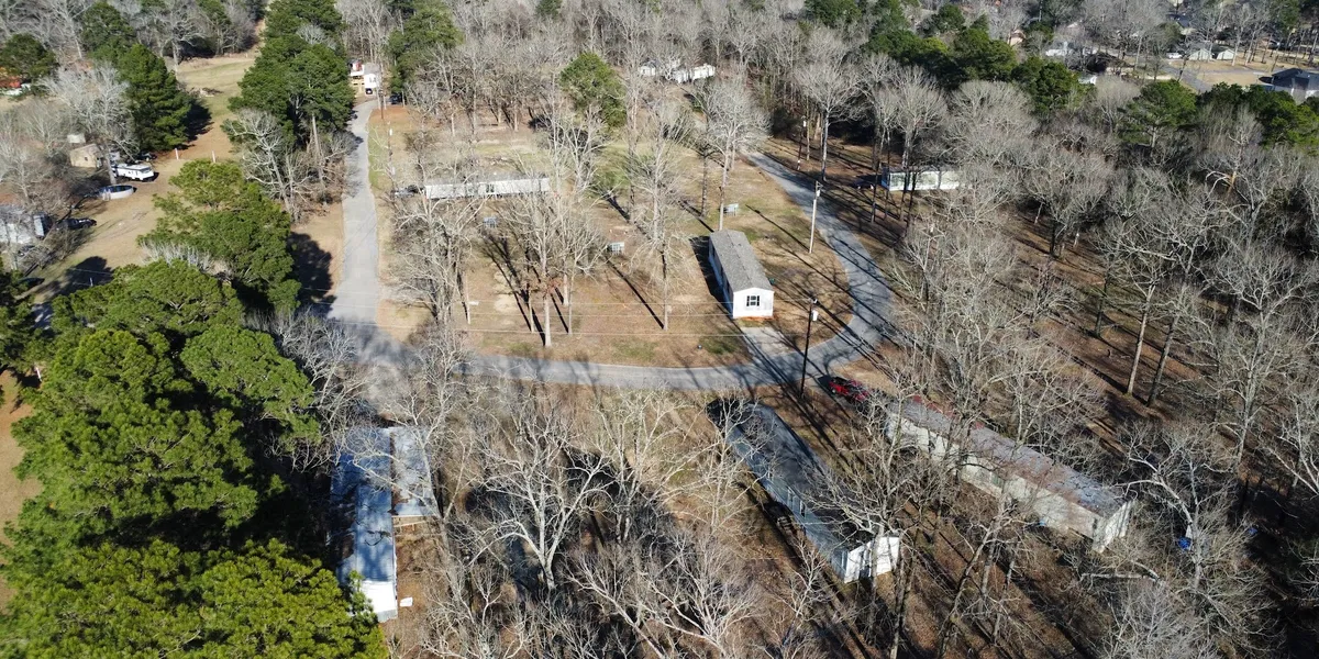 Serene mobile home community with well-maintained grounds, spacious lots, and a quiet country atmosphere just minutes...