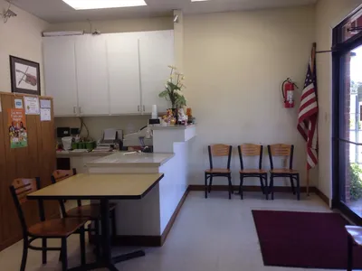 Small, unassuming seafood restaurant with modest exterior, serving freshly prepared seafood in a simple, no-frills setting.