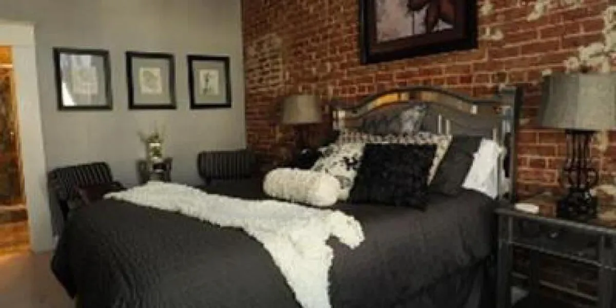 Historic inn with welcoming balcony overlooking Trenton Street, featuring classic architecture and outdoor seating in...