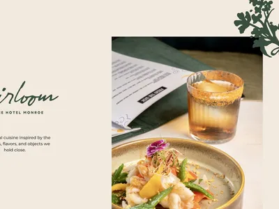 Elegant dining space in Heirloom Restaurant with festive decor, white tablecloths, and boutique hotel ambiance in...