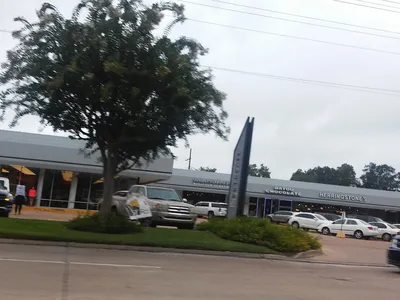 Elegant women's boutique with neatly arranged clothing displays, accessory showcases, and a sophisticated shopping...