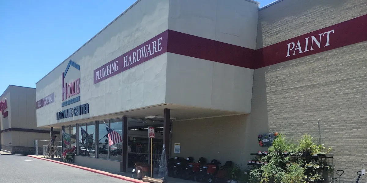 Neatly organized hardware store with traditional mom-and-pop layout, featuring clean aisles and diverse inventory of...
