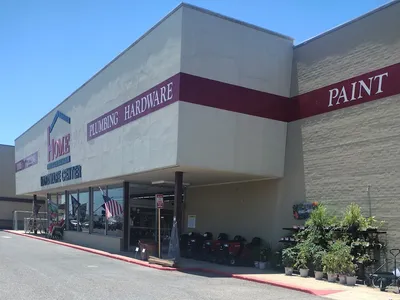 Neatly organized hardware store with traditional mom-and-pop layout, featuring clean aisles and diverse inventory of...