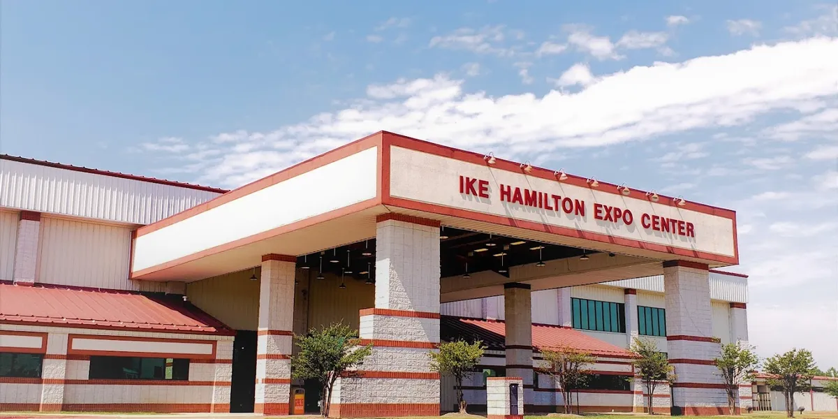 Spacious exposition center with attached stalls and arena setup, featuring convenient facilities and hotel access on the...