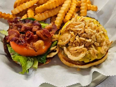 Casual family-owned restaurant with outdoor seating area, serving burgers on sourdough bread and loaded appetizers in...