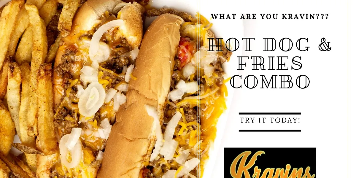 Black and earth-toned restaurant interior with wooden bench seating and a distinctive black barn door separating dining...