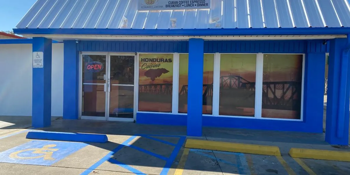 Cozy Honduran cafe with outdoor seating serving traditional Latin dishes and specialty coffee in a warm, family-friendly...