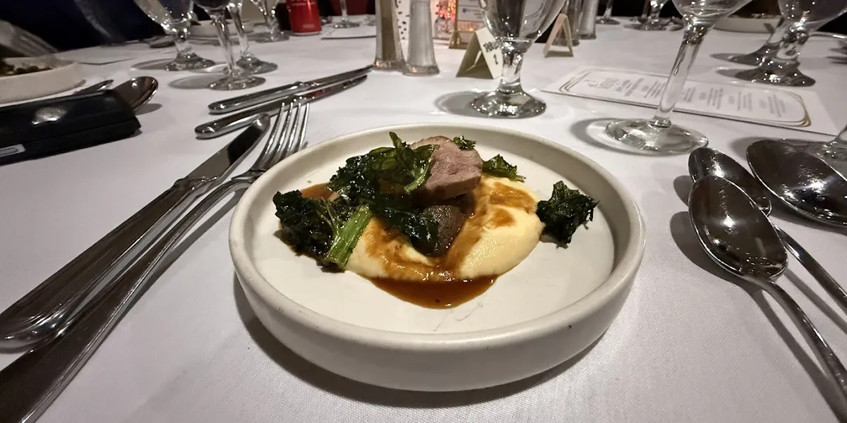 Historic speakeasy-style club interior with preserved architecture, elegant dining space, and panoramic views of downtown...