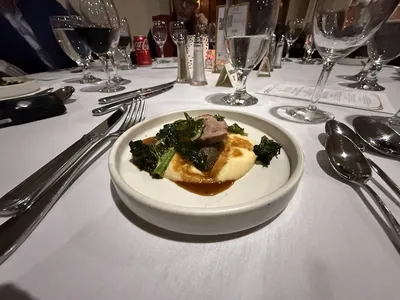 Historic speakeasy-style club interior with preserved architecture, elegant dining space, and panoramic views of downtown...