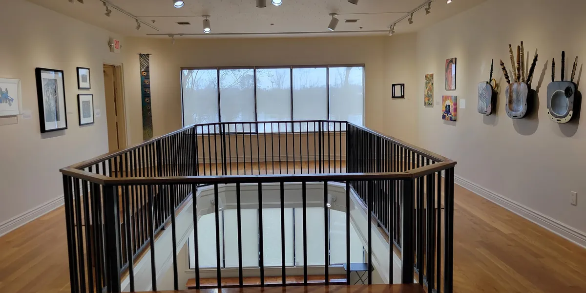 Historic Masur Museum building with exhibition spaces showcasing diverse art forms including sculptures and textiles in...