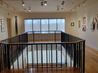 Historic Masur Museum building with exhibition spaces showcasing diverse art forms including sculptures and textiles in...