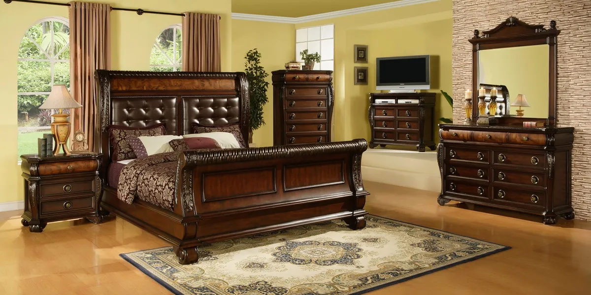 Showroom of affordable furniture displays at Miriam's on Trenton St, featuring living room sets and decorative fireplaces...