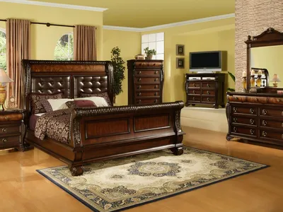 Showroom of affordable furniture displays at Miriam's on Trenton St, featuring living room sets and decorative fireplaces...