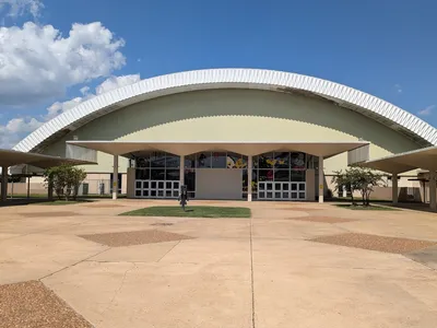 Multi-purpose Monroe Civic Center arena with hockey rink configuration, tiered seating, and southwest-facing plaza...