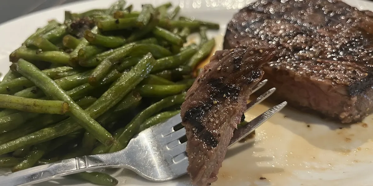 Elegant interior of Monroe's restaurant with upscale dining tables, ambient lighting, and sophisticated decor suitable...