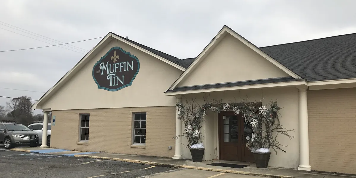 Carefully curated gift shop with diverse merchandise displays featuring unique cookware, jewelry, and specialty items in...